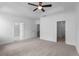 Spacious main bedroom with a ceiling fan and carpet flooring at 709 Dodd Ln # 165, Buford, GA 30518