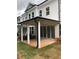 Covered patio perfect for outdoor enjoyment with access to the home and overlooking the backyard at 709 Dodd Ln # 165, Buford, GA 30518