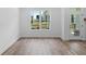 Bright room filled with natural light from large windows and wood-look floors at 709 Dodd Ln # 165, Buford, GA 30518