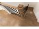 Staircase with wooden handrail and hardwood flooring; view from above at 709 Dodd Ln # 165, Buford, GA 30518