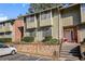 Attractive condo complex featuring a brick facade and well-maintained landscaping at 2220 Runnymead Se Rdg, Marietta, GA 30067