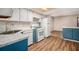 Bright kitchen features white cabinets, laminate countertops, and modern appliances at 2220 Runnymead Se Rdg, Marietta, GA 30067