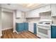 Bright kitchen features white cabinets, laminate countertops, and modern appliances at 2220 Runnymead Se Rdg, Marietta, GA 30067