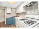 Updated kitchen with white cabinets, laminate countertops, and stainless steel appliances at 2220 Runnymead Se Rdg, Marietta, GA 30067
