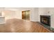 Bright living room with hardwood floors, fireplace, and sliding doors to the backyard at 2220 Runnymead Se Rdg, Marietta, GA 30067