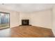 Cozy living room featuring hardwood floors, fireplace and a sliding door at 2220 Runnymead Se Rdg, Marietta, GA 30067