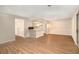Open-concept living area with hardwood floors and access to the kitchen at 2220 Runnymead Se Rdg, Marietta, GA 30067
