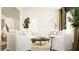 Bright living space with white sofas, a modern coffee table, and stylish decor at 256 Deer Valley Run, Canton, GA 30115
