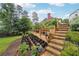 Picturesque backyard featuring a tiered garden and stone steps, perfect for gardening enthusiasts at 5535 Buck Hollow Dr, Alpharetta, GA 30005