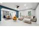 Open-concept basement with living and dining areas, featuring tile flooring and modern decor at 5535 Buck Hollow Dr, Alpharetta, GA 30005