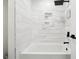 Modern bathroom with white subway tile, rainfall shower head, and built-in niche for toiletries at 5535 Buck Hollow Dr, Alpharetta, GA 30005