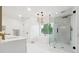 Bright bathroom featuring a glass shower, soaking tub, decorative tile and modern fixtures at 5535 Buck Hollow Dr, Alpharetta, GA 30005