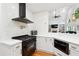 Gourmet kitchen featuring stainless steel appliances, quartz countertops, gas range, and decorative backsplash at 5535 Buck Hollow Dr, Alpharetta, GA 30005