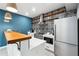 Charming kitchen boasting stainless steel appliances, a butcher block countertop, and stylish backsplash at 5535 Buck Hollow Dr, Alpharetta, GA 30005