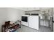 Well-appointed laundry room with modern appliances, ample storage, and patterned tile flooring at 5535 Buck Hollow Dr, Alpharetta, GA 30005