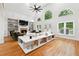 Bright living room featuring high ceilings, a fireplace, and plenty of natural light at 5535 Buck Hollow Dr, Alpharetta, GA 30005