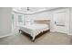 Spacious main bedroom features a tray ceiling, a fan, and large windows for ample natural light at 5535 Buck Hollow Dr, Alpharetta, GA 30005