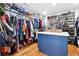 Spacious walk-in closet with custom shelving and ample storage space for clothes, shoes, and accessories at 5535 Buck Hollow Dr, Alpharetta, GA 30005