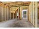 Unfinished basement displaying exposed framing, concrete floor, and stairs to the upper level at 706 Dodd Ln # 157, Buford, GA 30518
