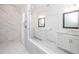 Bright bathroom with double vanities, marble shower, and contemporary fixtures at 706 Dodd Ln # 157, Buford, GA 30518
