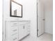 Stylish bathroom with white vanity, framed mirror, and pristine marble floors at 706 Dodd Ln # 157, Buford, GA 30518