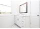Elegant bathroom vanity features a framed mirror, shaker cabinets, and modern fixtures at 706 Dodd Ln # 157, Buford, GA 30518