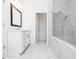 Spacious bathroom with marble floors, glass shower, and white shaker vanity at 706 Dodd Ln # 157, Buford, GA 30518