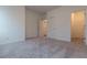 Spacious bedroom with neutral carpet and large walk-in closet for ample storage at 706 Dodd Ln # 157, Buford, GA 30518