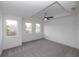 Bright bedroom with tray ceiling, ceiling fan, and large windows for natural light at 706 Dodd Ln # 157, Buford, GA 30518