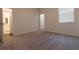 Well-lit bedroom showing window with blinds and door to bathroom, with soft carpet at 706 Dodd Ln # 157, Buford, GA 30518