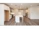 Spacious open-concept kitchen with white cabinets, large island, and stainless steel appliances at 706 Dodd Ln # 157, Buford, GA 30518