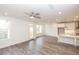Sunlit living space showcasing sleek gray flooring and a door to the outdoor area at 706 Dodd Ln # 157, Buford, GA 30518