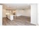 Open floor plan featuring a modern kitchen flowing into a bright living space at 706 Dodd Ln # 157, Buford, GA 30518