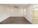 Open-concept living room with wood floors, ceiling fan, and access to an outdoor area at 706 Dodd Ln # 157, Buford, GA 30518