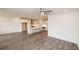 Spacious living area open to kitchen featuring gray floors and ample natural light at 706 Dodd Ln # 157, Buford, GA 30518