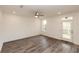 Spacious, light-filled room with wood-look floors and access to a deck at 706 Dodd Ln # 157, Buford, GA 30518