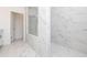 Shower with glass enclosure features sleek marble tile and a built-in shower seat at 706 Dodd Ln # 157, Buford, GA 30518