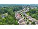 Aerial view of a residential area with a mix of houses nestled among trees at 728 Lorimore Pass, Canton, GA 30115