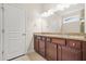 Bathroom with a double vanity, granite counters, and ample storage space at 728 Lorimore Pass, Canton, GA 30115