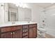 Bathroom featuring double sink vanity, a mirror, toilet and shower with tub at 728 Lorimore Pass, Canton, GA 30115