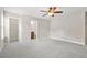 Bright bedroom with gray carpet features a doorway to the bathroom and closet at 728 Lorimore Pass, Canton, GA 30115