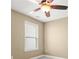 Beige bedroom featuring a ceiling fan, window and gray carpeting at 728 Lorimore Pass, Canton, GA 30115