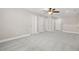 Spacious bonus room with neutral carpeting and ceiling fan at 728 Lorimore Pass, Canton, GA 30115