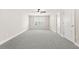 Spacious bonus room featuring neutral carpet, a window, and closets at 728 Lorimore Pass, Canton, GA 30115