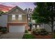 Charming two-story home with a well-manicured lawn, a two-car garage, and a welcoming front entrance at 728 Lorimore Pass, Canton, GA 30115