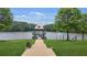 Scenic view of a lakeside gazebo, steps lead to a lawn and beautiful lake views at 728 Lorimore Pass, Canton, GA 30115