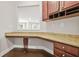Dedicated office area with granite counters, custom cabinets, and view into living space at 728 Lorimore Pass, Canton, GA 30115