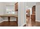 Dedicated office nook with a granite countertop, drawers, cabinets, and a window offering a view of the living space at 728 Lorimore Pass, Canton, GA 30115