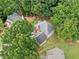 Overhead view of a home surrounded by mature trees and greenery at 1440 Boundary Blvd, Suwanee, GA 30024