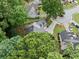 Aerial shot of a property with mature trees, landscaping, and a long driveway in a quiet neighborhood at 1440 Boundary Blvd, Suwanee, GA 30024